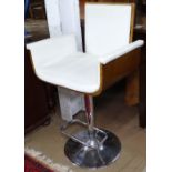 A modern bent-ply and chrome adjustable bar stool