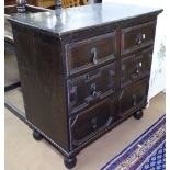 A Jacobean style small oak chest of 2 short and 2 long drawers, on bun feet, W76cm, H76cm