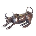 A polished spelter bull sculpture, unsigned, length 28cm