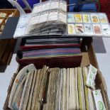 A boxful of Brooke Bond tea card albums, and various albums containing sets of tea cards