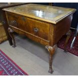 An Antique cross-banded walnut lowboy, single frieze drawer, shaped apron, on cabriole legs,