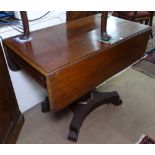 A William IV mahogany drop leaf breakfast table, end frieze drawer, on a centre column and