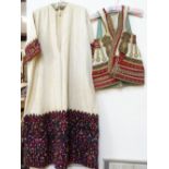 An Eastern handmade waistcoat with gold braid and embroidered decoration, and a cotton tunic with