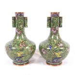 A pair of Oriental copper and cloisonne vases, bird and floral decoration, height 16cm