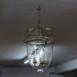 An engraved dome shape hanging glass lantern