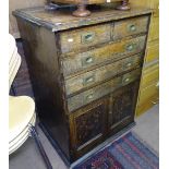 A Victorian military oak cabinet, with 2 short and 3 long drawers and cupboards under, recessed