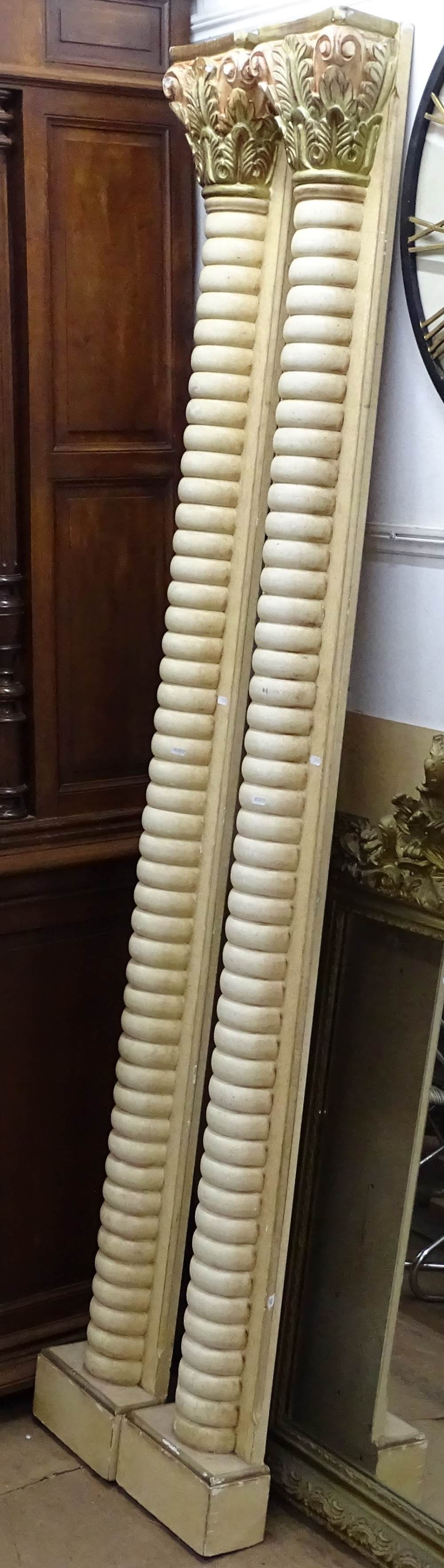 A large pair of split turned Corinthian columns, H223cm, W26cm