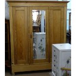 A Continental polished pine mirrored-door armoire, W162cm, H194cm, D66cm