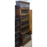 An early 20th century 6-section oak Globe-Wernicke bookcase, with drawer fitted to the base,