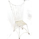 A small white painted wrought-iron doll's chair, with pierced seat and wirework wing-back, height