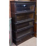 An early 20th century oak 4-section Globe-Wernicke bookcase, with bevelled-glass panels and drawer