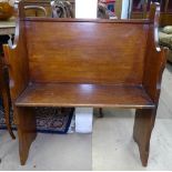 A small panelled stained wood settle, W76cm