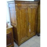 A 19th century Continental fruitwood cupboard with 2 panelled doors, W124cm, H174cm, D53cm