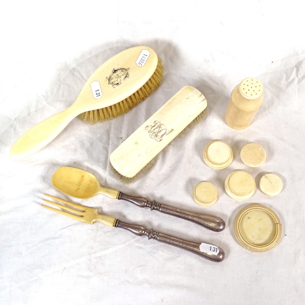 A Victorian ivory dressing table brush, French silver-handled salad servers etc