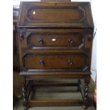 A 1920s oak 2-drawer bureau, W63cm