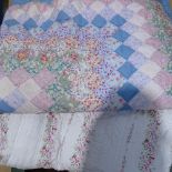 A double-sized cotton bed quilt, and another with rosebud pattern