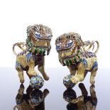A pair of Chinese silver-gilt and enamel Dogs of Fo, length 8cm