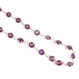 An unmarked gold rhodolite garnet line necklace, necklace length 46cm, 6.5g Very good original