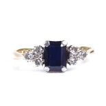 An 18ct gold sapphire and diamond dress ring, total diamond content approx 0.18ct, setting height