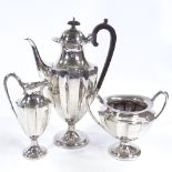 An Edwardian 3-piece silver tea set, tapered gear-form with pedestal supports, by Mappin & Webb,