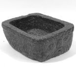 WITHDRAWN A solid granite water sink / fountain, with carved face and spout to one end
