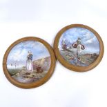 A pair of large 19th century French ceramic wall plates, with hand painted designs of fisher