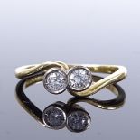 An 18ct gold 2-stone diamond crossover ring, total diamond content approx 0.24ct, maker's marks E