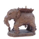 An Indian carved hardwood elephant design ink stand with ivory knop, length 16cm Three of the tiny