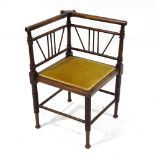 A late Victorian Aesthetic Movement Thebes style corner chair, in the manner of E W Godwin