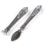 2 Art Nouveau German silver desk items, comprising a letter opener and desk deal, relief floral