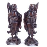 A pair of oriental carved hardwood figures, largest height 36.5cm Generally in good overall