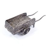 A Dutch silver miniature novelty cart, relief embossed lover decoration with floral foliate side