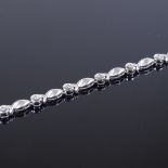 A 14ct white gold diamond collar necklace, with textured and polished twist settings, total