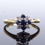 An 18ct gold sapphire and diamond cluster ring, total diamond content approx 0.12ct, maker's marks