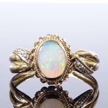 An 8ct gold cabochon opal dress ring, with openwork shoulders and rope twist surround, setting
