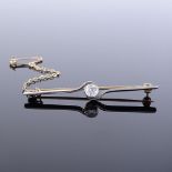 An unmarked gold 0.3ct solitaire diamond bar brooch, brooch length 50.1mm, 3.3g Very good original