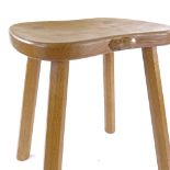 Robert Mouseman Thompson, golden oak stool on tapered octagonal legs, seat dimensions 36cm x 30cm,