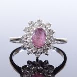 A 9ct white gold pink sapphire and diamond cluster ring, total diamond content approx 0.2ct