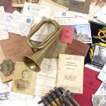 A group of militaria, including brass bugle, booklets, ephemera etc