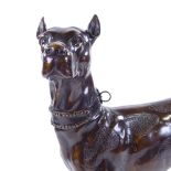 A patinated bronze standing dog, signed on the tail, height 52cm Probably mid to late 20th