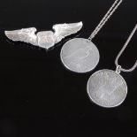 An American Air Force Navigator sterling silver wings brooch, and 2 silver dollar pendant necklaces,