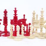 A 19th century natural white and red stained ivory chess set, King height 9cm, complete and in
