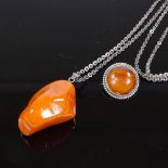 A Scandinavian silver-mounted amber pendant necklace, and an amber and silver brooch, pendant height