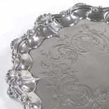 A Victorian circular silver salver, scalloped foliate border with engraved decoration, by Joseph