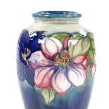 A large Moorcroft Pottery Clematis pattern vase, height 23cm Perfect condition, no chips cracks or