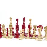 A 19th century natural and red stained ivory chess set, King height 8cm, complete and in good