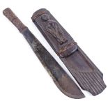 An Ethnic knife, with rattan-bound grip, original wood scabbard with relief carved figure, overall