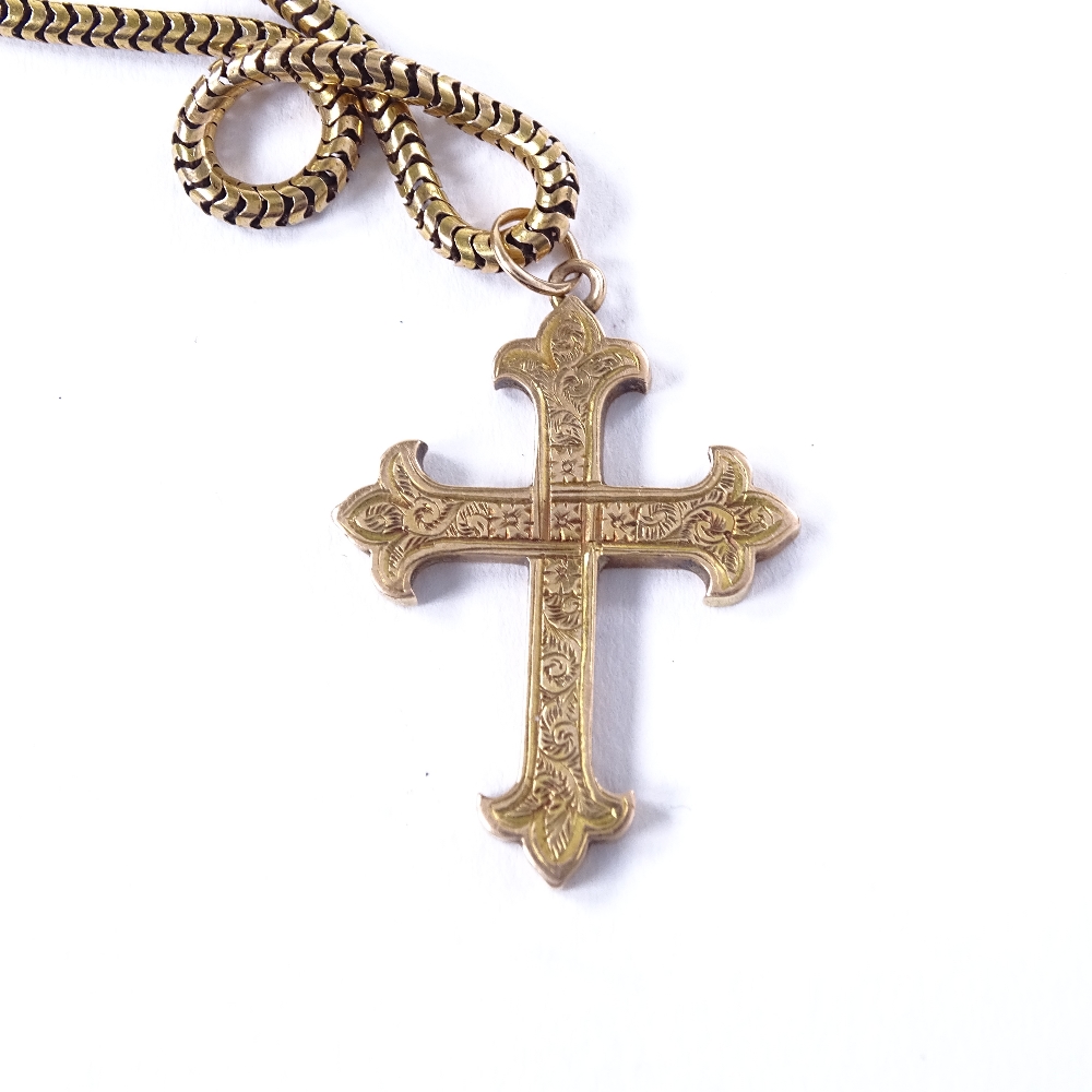 An unmarked gold cross pendant necklace, on 9ct snake-link chain, floral engraved cross, pendant - Image 4 of 4