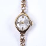 ACCURIST - a lady's 9ct gold mechanical wristwatch, silvered dial with Arabic and baton hour