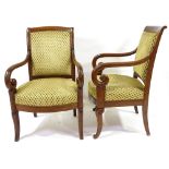 A pair of 19th century French Empire style mahogany-framed armchairs